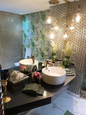a bathroom with two sinks and a large mirror at Luxury spacious apartment racine casablanca in Casablanca