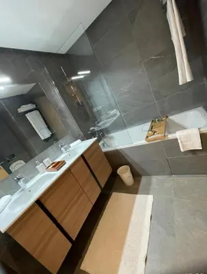 a bathroom with a sink and a bath tub at Carrousel Atlantic View in Rabat