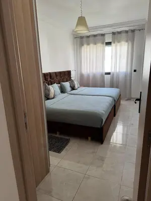 a bedroom with a large bed in a room at Premium comfort, 150m from Val d'Or beach, 2 swimming pools in Temara