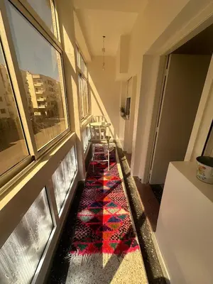 a hallway with a colorful rug on the floor at Appartement 500 m from Moulay Abdellah Stadium in Temara