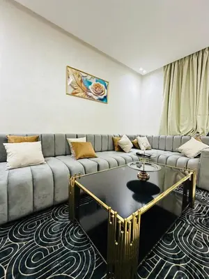 a living room with a couch and a coffee table at studio bien aménagé, ambiance chaleureuse 19 in Casablanca