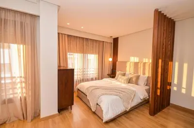 a bedroom with a bed and a large window at Studio 01 Maarif - High Speed Wi-Fi in Casablanca