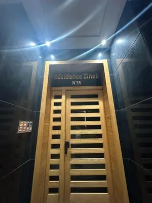 a door in a building with a sign on it at Studio lumineux pour un séjour agréable 28 in Casablanca