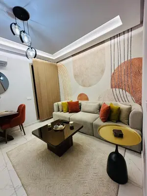 a living room with a couch and a table at Studio moderne et accueillant, pour se reposer 14 in Casablanca