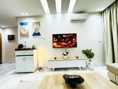 a living room with a tv on the wall at Studio cosy et calme, idéal pour se détendre 15 in Casablanca
