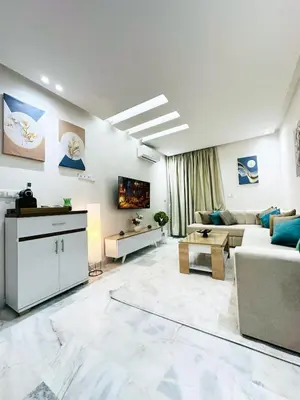 a living room with a couch and a table at Studio cosy et calme, idéal pour se détendre 15 in Casablanca