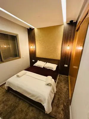 a hotel room with two beds and a window at Studio tout équipé pour un séjour confortable 22 in Casablanca