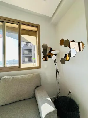 a living room with a couch and a window at Studio tout équipé pour un séjour confortable 22 in Casablanca