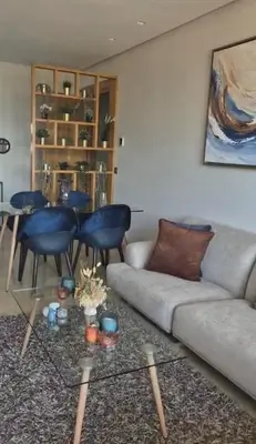 a living room with a couch and a table at Appartement CFC - Anfasky in Casablanca
