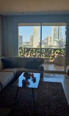 a living room with a couch and a glass table at Appartement CFC - Anfasky in Casablanca
