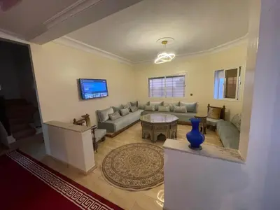 a living room with a couch and a table at Large Villa Pool And Garden on 5200 m in Berrechid