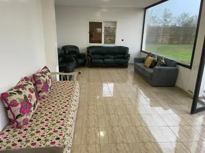 a living room with a couch and couches at Large Villa Pool And Garden on 5200 m in Berrechid