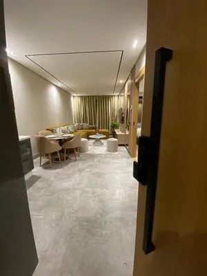 a living room with a couch and a table at Beau Living Park Residence Bright Central Cosy Apartment Beauséjour Centre De Casablanca En Face De Anfa Park in Casablanca