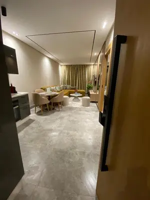 a living room with a couch and a table at Beau Living Park Residence Bright Central Cosy Apartment Beauséjour Centre De Casablanca En Face De Anfa Park in Casablanca
