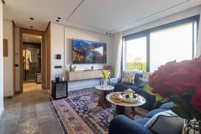 a living room with a couch and a table at Business Executive Apartment Central Casablanca in Casablanca