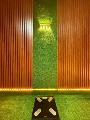 a room with a green wall with asoundboard in front at Business Executive Apartment Central Casablanca in Casablanca