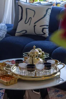 a serving tray with a tea set on a table at Business Executive Apartment Central Casablanca in Casablanca