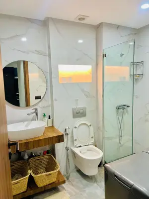 a bathroom with a toilet and a sink and a shower at Caprice living in Casablanca