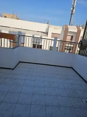 a balcony with a fence and a tile floor at Superbe studio a avenue france agdal in Rabat
