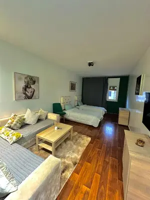 a living room with a couch and a table at appartement au coeur de Rabat in Rabat