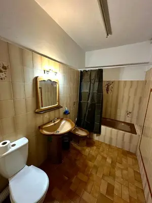 a bathroom with a toilet and a sink and a tub at appartement au coeur de Rabat in Rabat