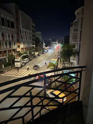 a view of a city street at night from a balcony at Rihab's House in Casablanca
