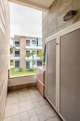 a kitchen with a large window in a building at Cosy 2 Bedrooms Skhirat Residence in Skhirat