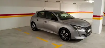a small silver car parked in a garage at Appartement Piscine Gare Oasis in Casablanca