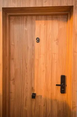 a wooden door with a speaker on it at Studio 09 Maarif - High Speed Wi-Fi in Casablanca