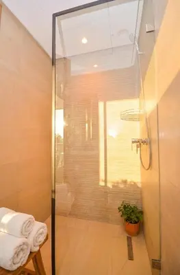 a shower with a glass door in a bathroom at Studio 09 Maarif - High Speed Wi-Fi in Casablanca