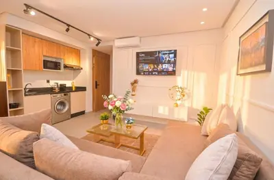 a living room with a couch and a table at Studio 09 Maarif - High Speed Wi-Fi in Casablanca