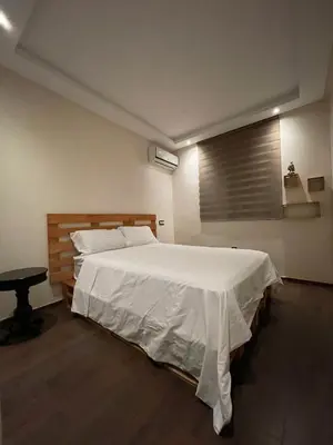 a bedroom with a large white bed with a window at Bright and cozy studio in Tamaris Beach in Tamaris