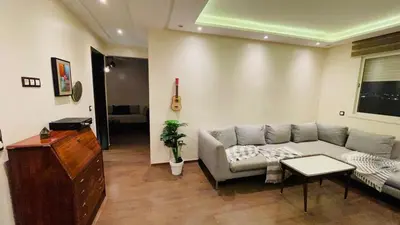 a living room with a couch and a table at Bright and cozy studio in Tamaris Beach in Tamaris
