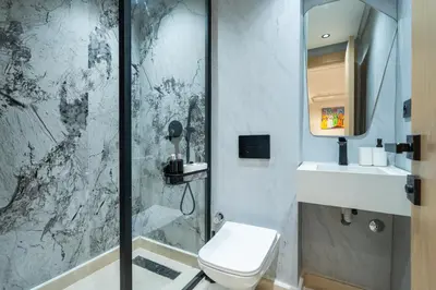 a bathroom with a shower and a toilet and a sink at Maarif Premium 2 Bedrooms 2 Bathrooms La Reine II in Casablanca