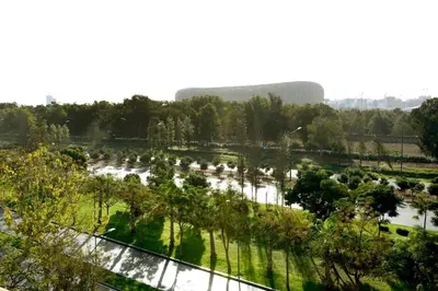 a view of a park with trees and water at Appartement familial convivial in Rabat