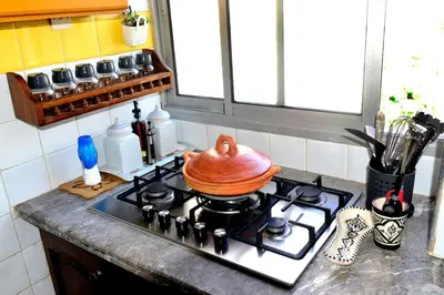 a pot sitting on top of a stove in a kitchen at Appartement familial convivial in Rabat