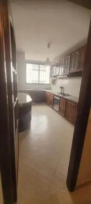 a kitchen with a sink and a tub in it at Grand appartement avec une belle vue in Rabat