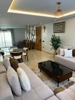 a living room with a couch and a table at Séjour Premium Casablanca in LʼOasis