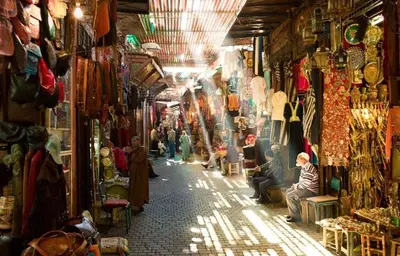 a group of people sitting in a shop in a market at 3BR Authentic Apartment in the heart of Casablanca in Casablanca