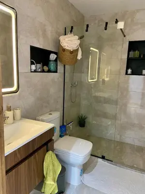 a bathroom with a shower and a toilet and a sink at Le Miroir in Casablanca