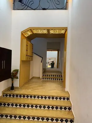a stairway leading into a building with a hallway at Charming Apartment in Temara Near Beach & Rabat in Temara