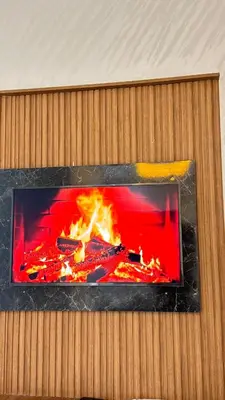 a fireplace with a red and black at Nice apartment in temara-a in Temara