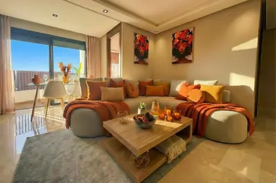 a living room with a couch and a table at Maya Suites - Habous Old Town - Panoramic City View in Casablanca
