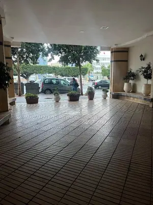 an empty lobby with potted plants in a parking lot at Apartment or Rooms for couples and single people in luxurious apartment in Rabat