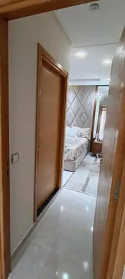 a room with a door leading to a bedroom at Temara wifak in Temara