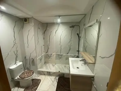 a bathroom with a toilet and a sink at Casablanca Comfortable City-Centre Apartment in Casablanca