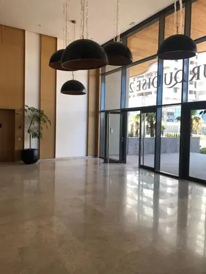 an empty lobby with pendant lights in a building at Marina de Casablanca in Casablanca