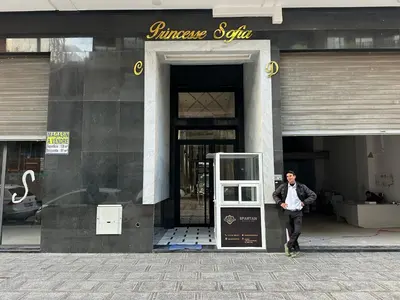 a man is walking out of a building at Modern Apartment in Maarif Princess in Casablanca