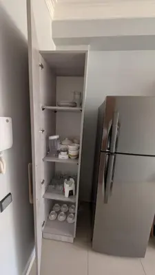 a kitchen with a refrigerator in a room at Blue Haven Pool Suites in Pont Blondin