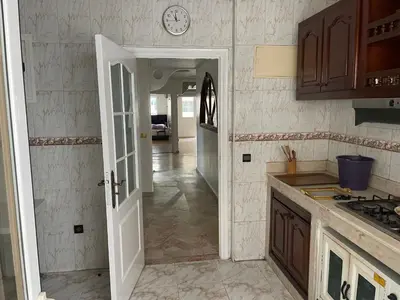 a kitchen with a door leading to a hallway at Casablanca Apartments & B&Bs in Casablanca